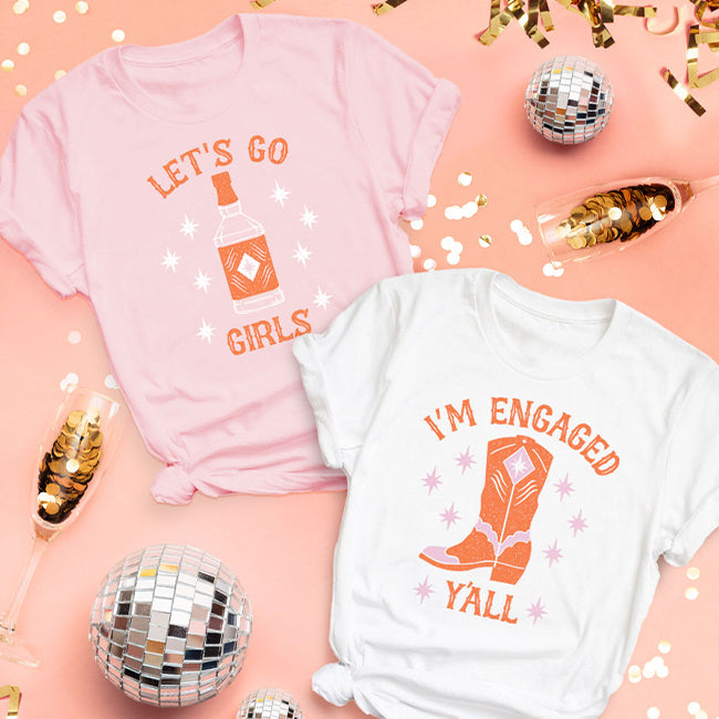 shop graphic shirts - women's let's go girls tee + women's i'm engaged y'all tee