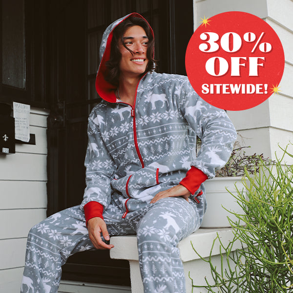 shop christmas jumpsuits - model wearing men's grey moose jumpsuit