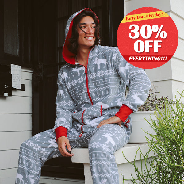 shop christmas jumpsuits - model wearing men's grey moose jumpsuit