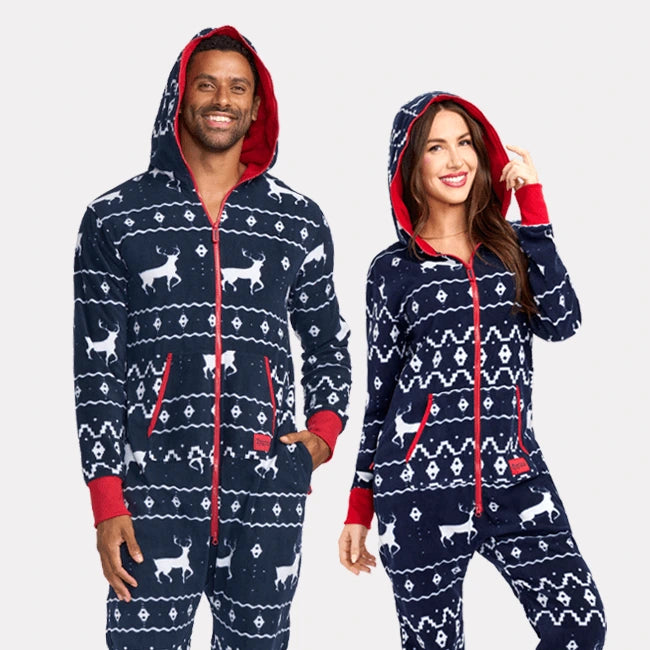 shop onesies - image of man and woman wearing matching blue reindeer jumpsuits