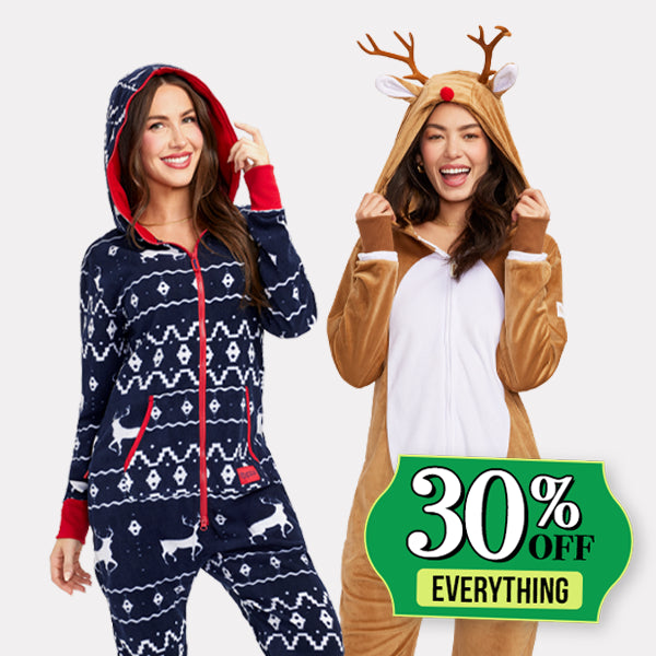 shop 30% off jumpsuits - image of models wearing women's blue reindeer jumpsuit and women's rudolph jumpsuit