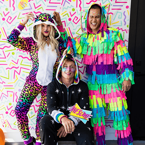 shop halloween - models wearing 90's leopard jumpsuit costume, men's nite mare unicorn jumpsuit costume, and men's pinata jumpsuit costume 