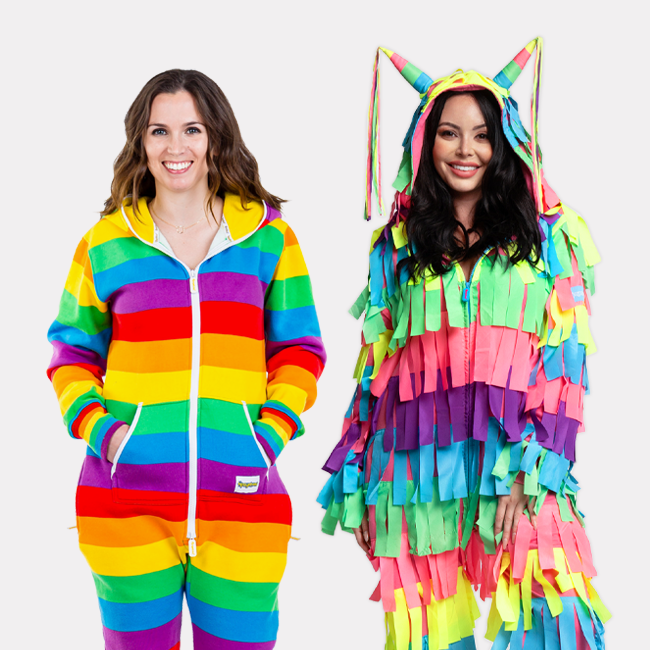 shop onesies - models wearing women's rainbow jumpsuit and women's pinata costume