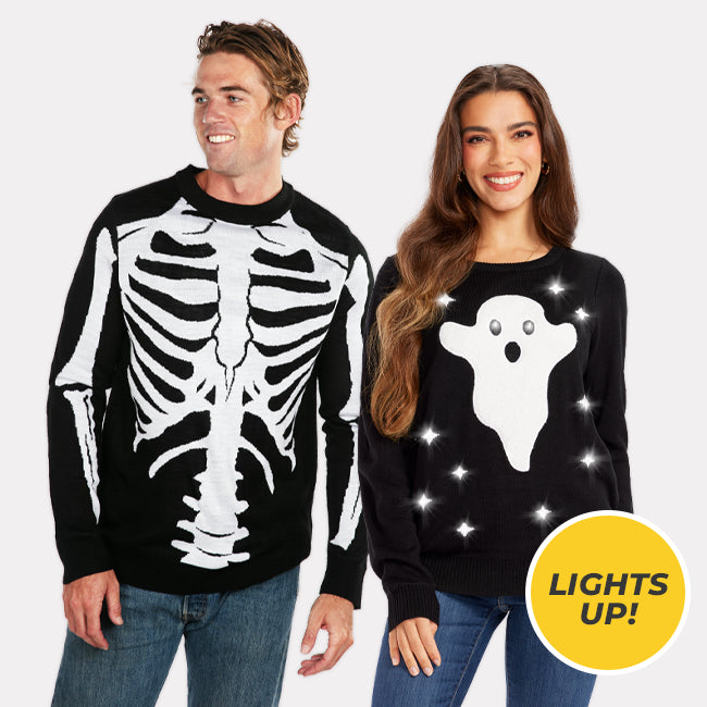 shop halloween clothing - men's skeleton sweater and women's ghost light up sweater