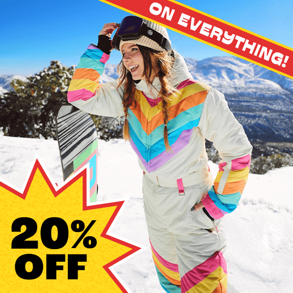 shop snow suits - image of model wearing women's retro rainbow snow suit