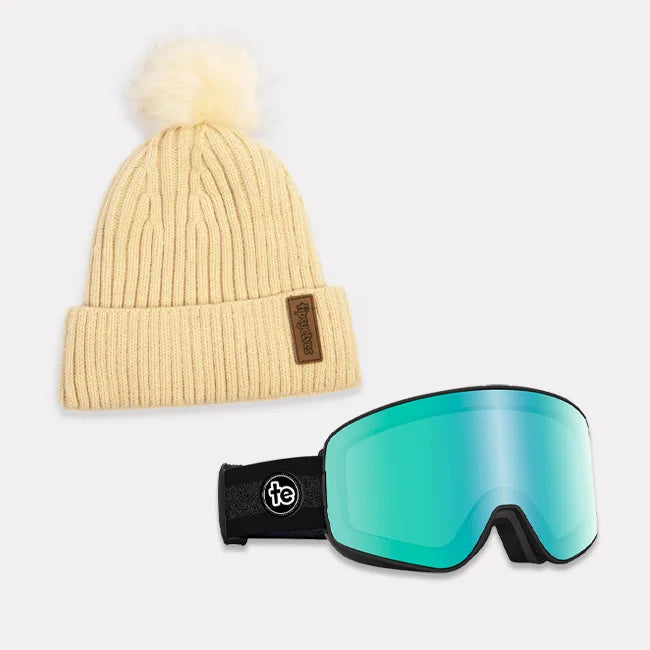 shop snow accessories - cream pom beanie with liner and teal tundra cascade goggles