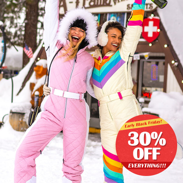 shop women's snow suits - models wearing women's retro rainbow and powder pink snow suits