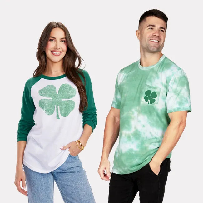 shop graphic tees - men's faded frolic tee and women's lucky clover long sleeve shirt