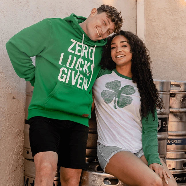 shop st. paddy's - man wearing sweatshirt and woman wearing long sleeve tee